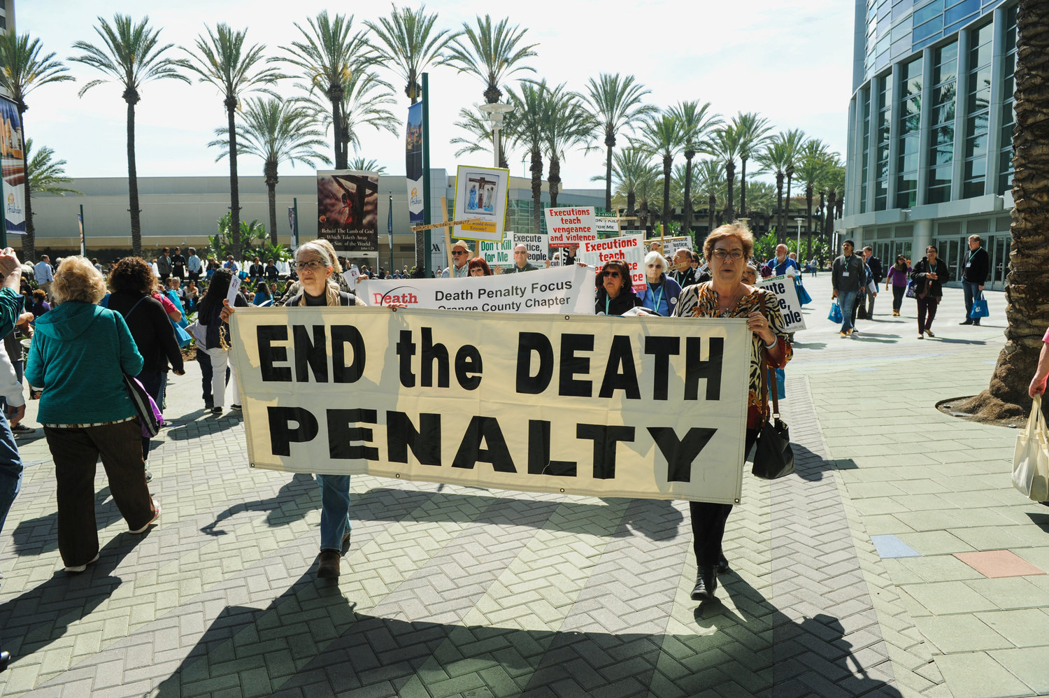 Demonstrators march through a courtyard to protest the death penalty during a rally organized by “Catholics Against the Death Penalty-Southern California” in Anaheim Feb. 25, 2017. On May 30, 2019, New Hampshire became the 21st state to ban capital after lawmakers garnered enough votes to override Gov. Chris Sununu’s veto of a bill to repeal the death penalty in the state.